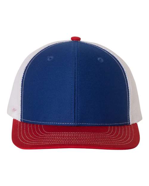 Trucker cap with navy front panels, white mesh sides, and red curved brim